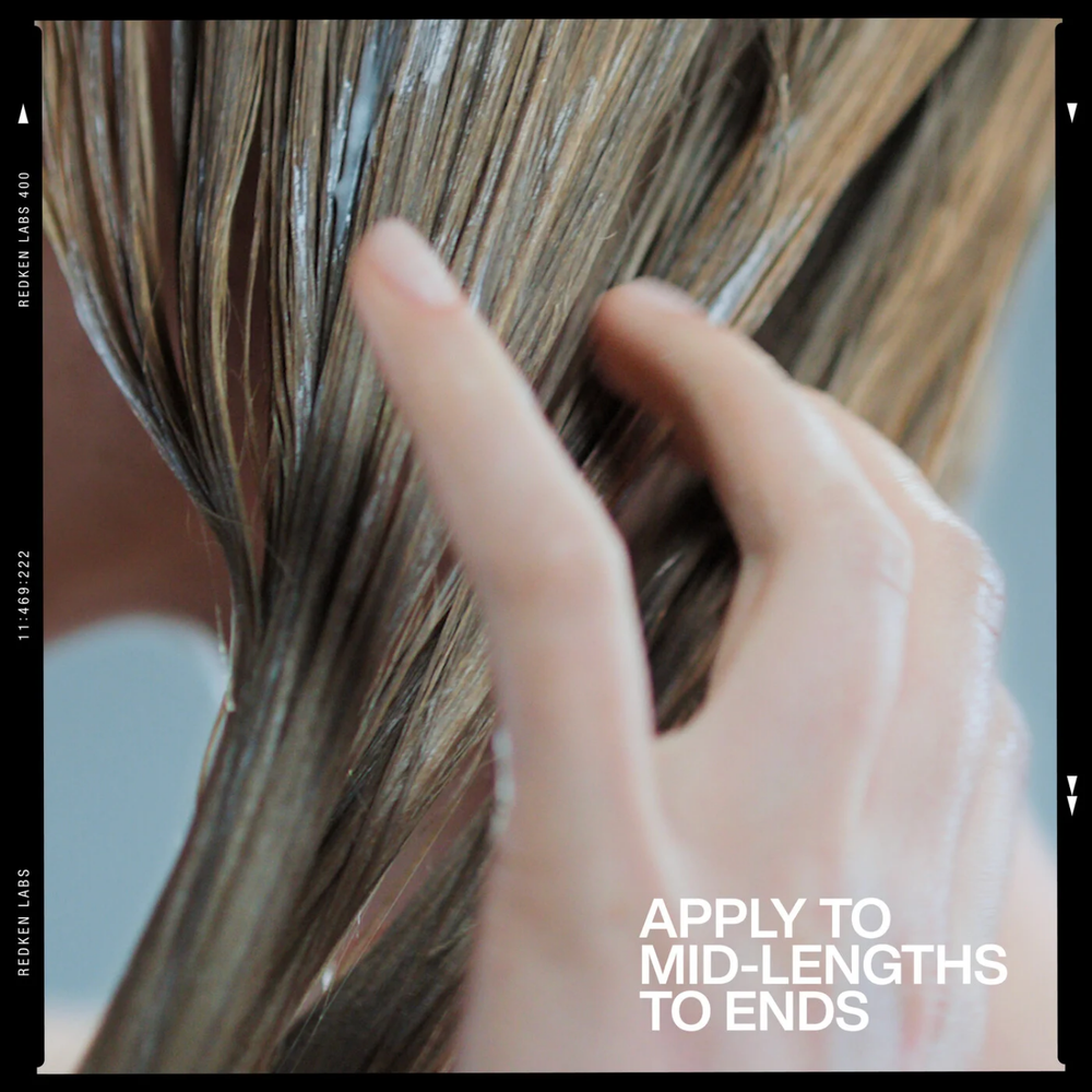 Redken Acidic Grow Full Densifying Conditioner pour cheveux fins et plats, après-shampoing volumisant professionnel.