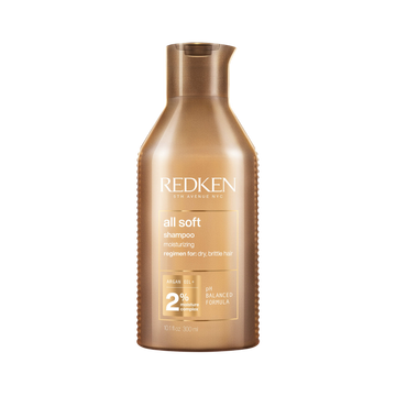Flacon de Redken All Soft Shampoo, shampooing adoucissant à l’huile d’argan pour cheveux secs et abîmés.