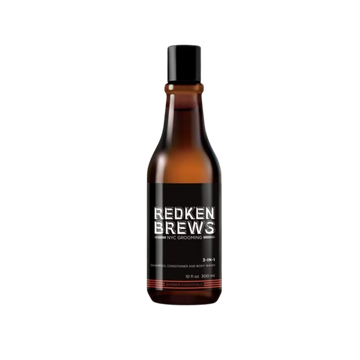 Flacon 3‑en‑1 Redken Brews, étiquette noire et bleue, soin cheveux et corps pour usage quotidien masculin