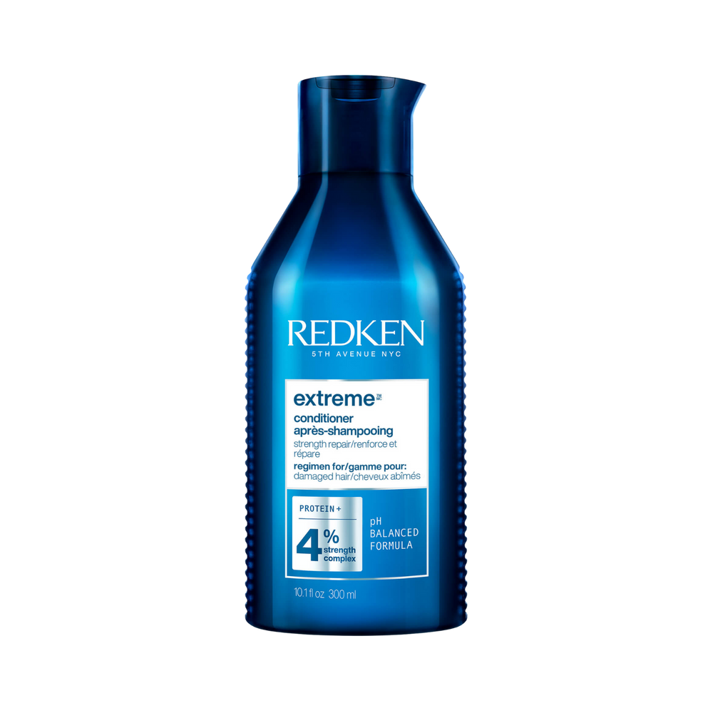 Flacon de revitalisant Redken Extreme pour cheveux abîmés, enrichi en protéines RCT pour renforcer et lisser la fibre capillaire