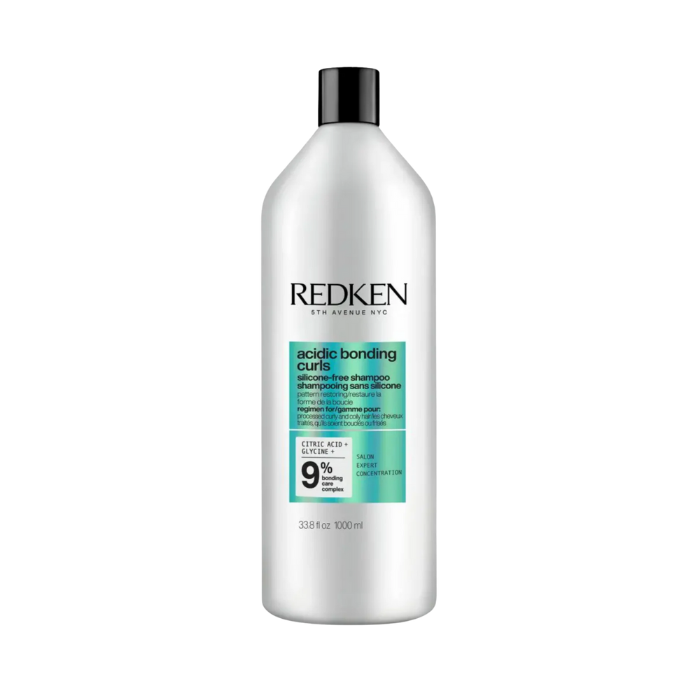Flacon du revitalisant Acidic Bonding Curls Redken pour cheveux bouclés, sans silicone.