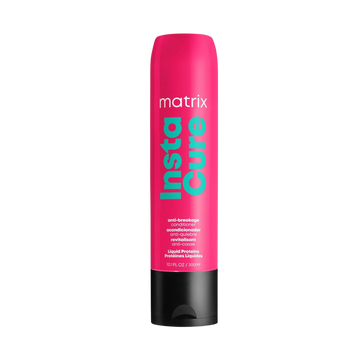 “Flacon 1000 ml du revitalisant anti‑casse Instacure de Matrix — tube crème blanc avec logo noir et accents verts”