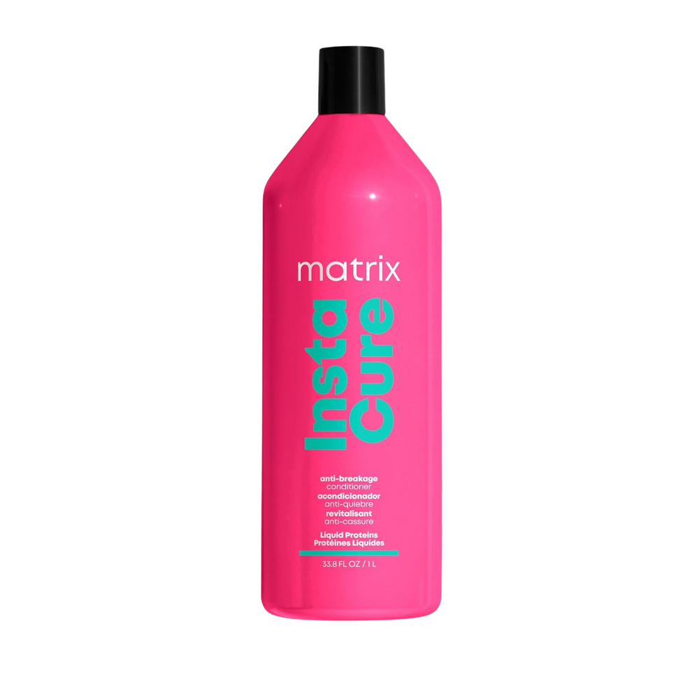 “Flacon 1000 ml du revitalisant anti‑casse Instacure de Matrix — tube crème blanc avec logo noir et accents verts”