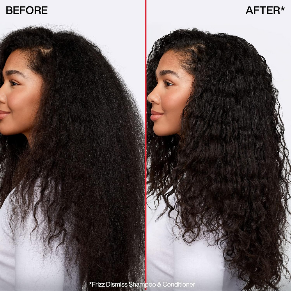 Flacon du sérum huile Redken Frizz Dismiss Instant Deflate, soin anti‑frisottis leave‑in enrichi en huile de babassu, pour cheveux lisses et brillants.