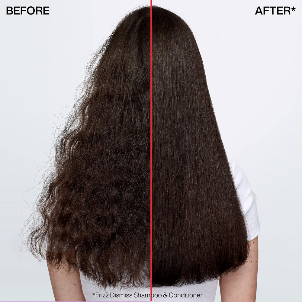 Flacon du sérum huile Redken Frizz Dismiss Instant Deflate, soin anti‑frisottis leave‑in enrichi en huile de babassu, pour cheveux lisses et brillants.