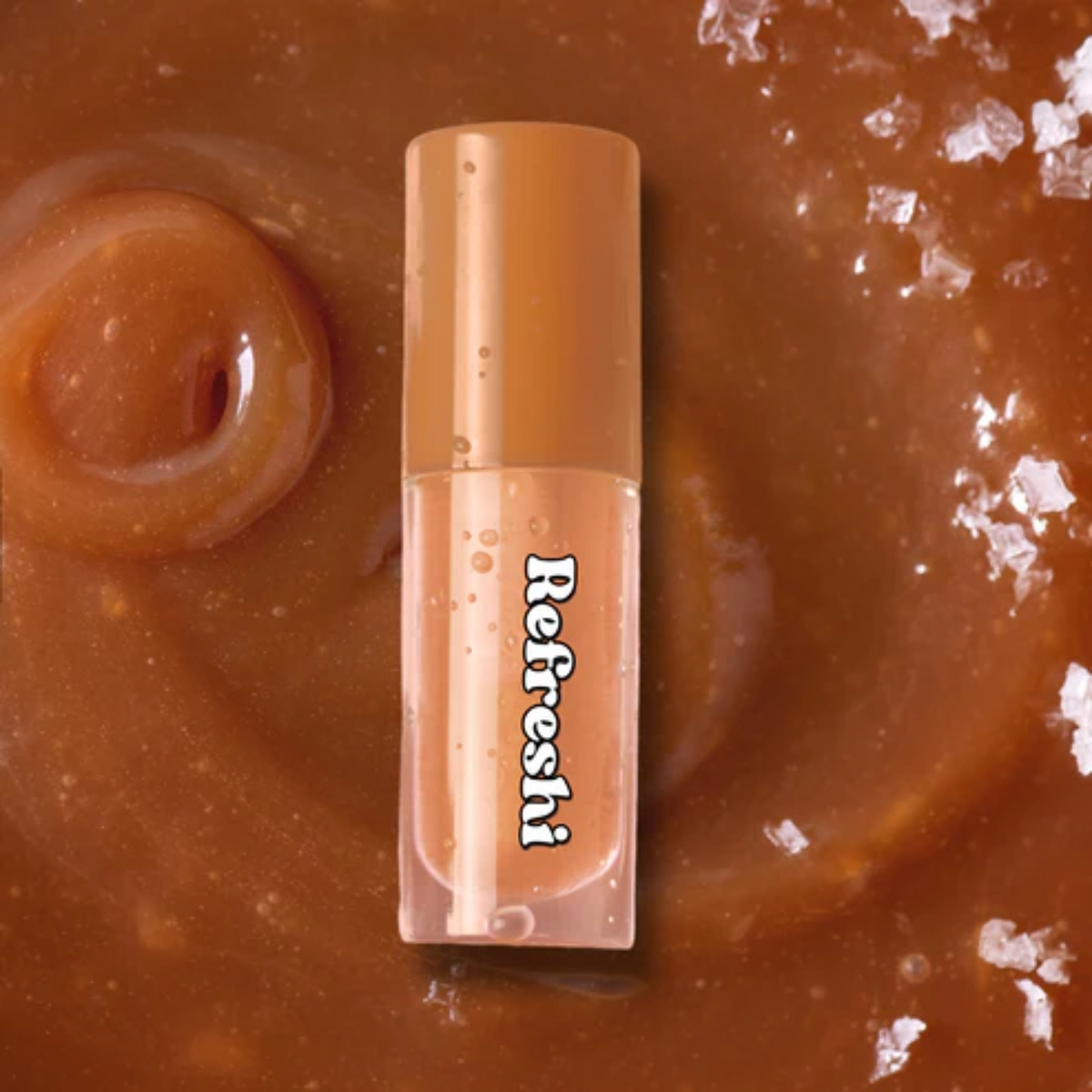 Tube 5 ml Salted Caramel Lip Oil Refreshi, texture brillante non collante, parfum caramel salé, bulles anti‑débordement, soin vegan

