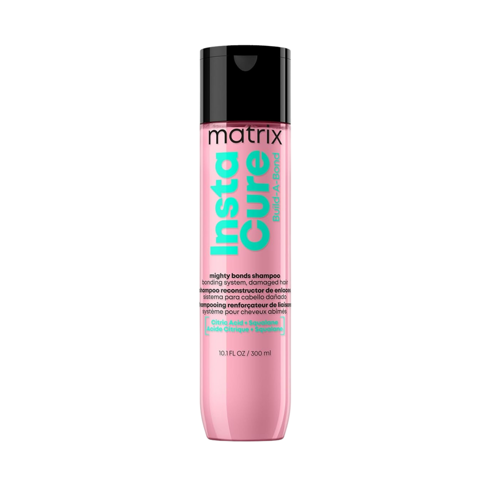 “Flacon de shampoing Instacure Build‑A‑Bond Matrix — étiquette rose pâle avec logo Matrix”