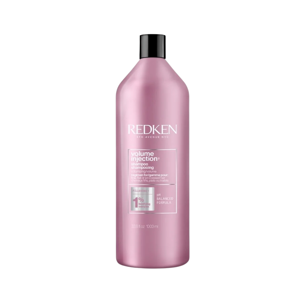 Flacon 1000 ml du shampooing Volume Injection Redken sur fond clair.