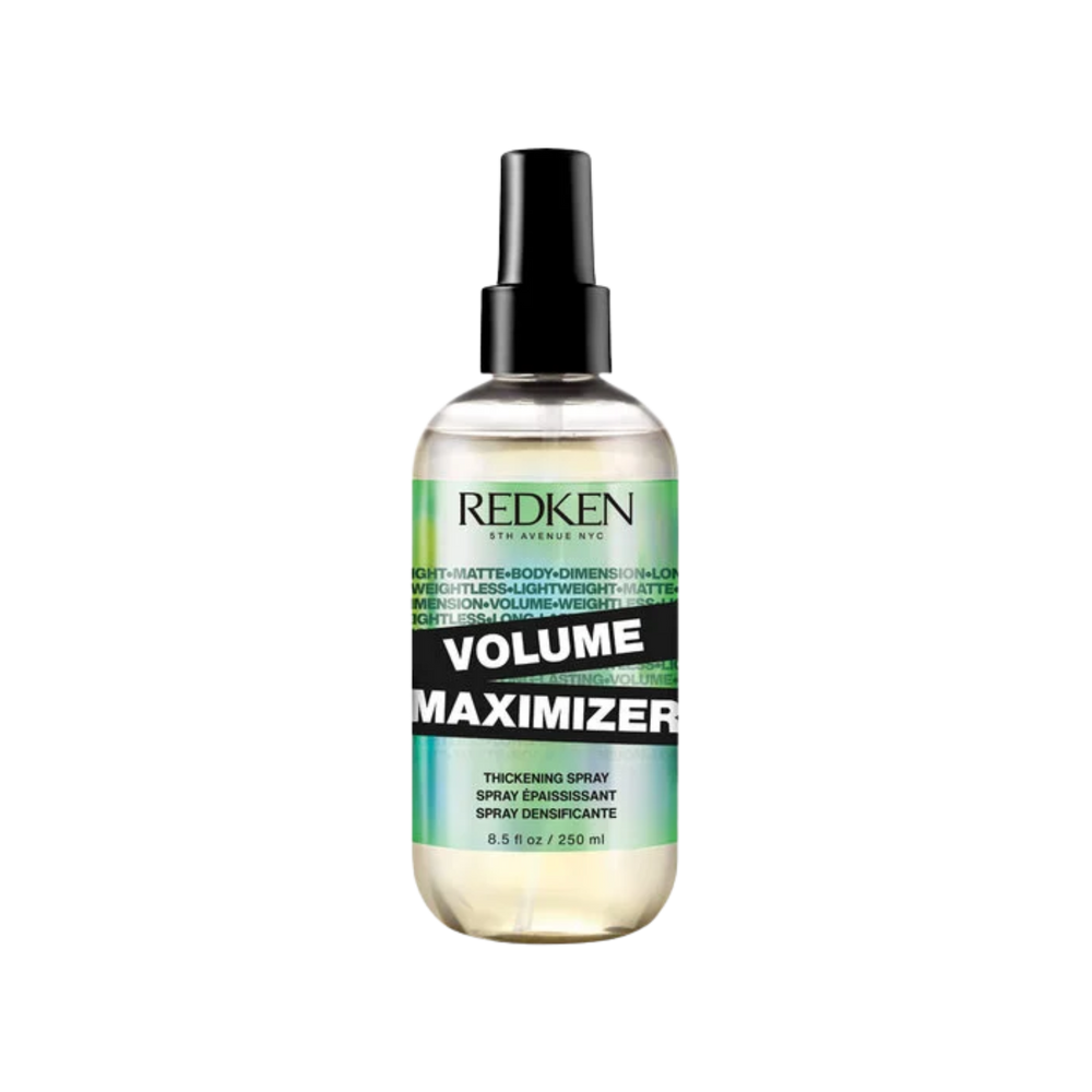 Flacon spray 250 ml du Volume Maximizer Redken posé sur fond neutre.