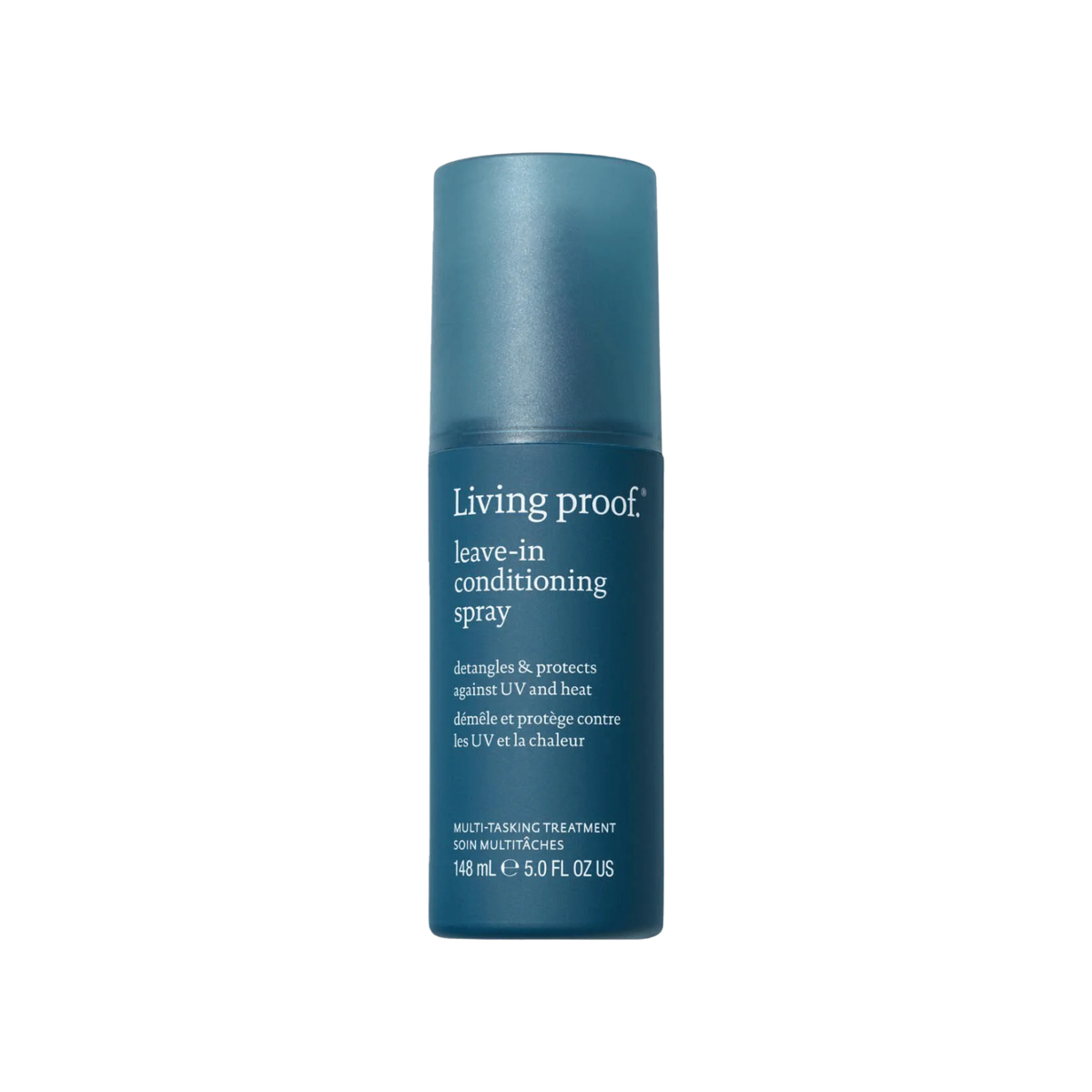 Flacon de spray sans rinçage Living Proof posé sur une surface claire, avec un fond neutre et des cheveux démêlés en arrière-plan

