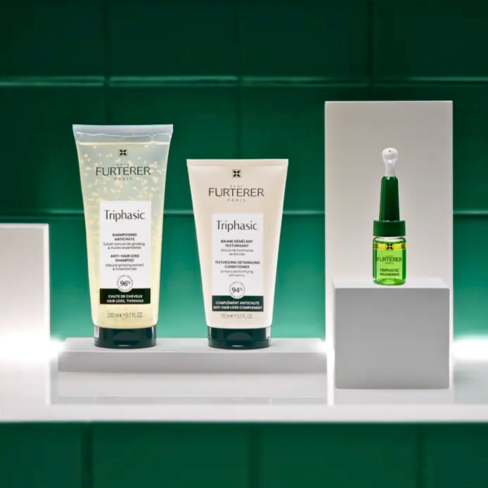 “Flacon du shampooing densifiant Triphasic René Furterer éclatant”